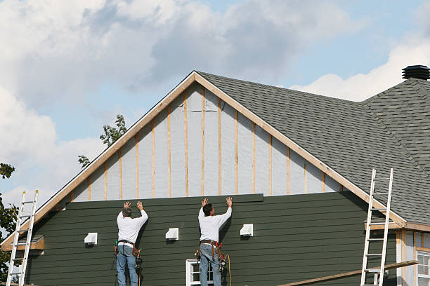 Professional Storm Damage Siding Repair technician working in Bloomingdale, OH